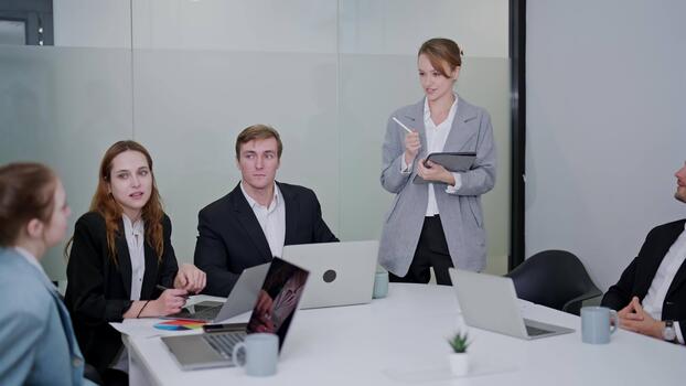 Team discussing plans in a meeting room